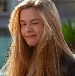 A girl scrunching up her face, as if thinking hard about something.