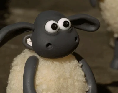 A claymation sheep giving thumbs up sign.