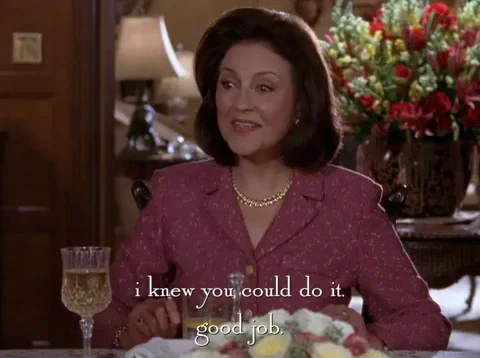 Emily Gilmore from Gilmore Girls sitting at a dining table. She says, 