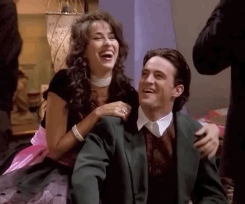 scene from TV show Friends. Janice laughs and hugs Chandler's shoulders while he says kill me, kill me now