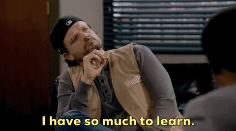 A man in a classroom saying, 