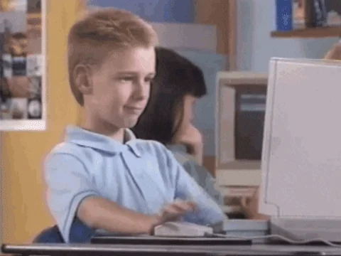 A kid looks at a computer screen that reads: 