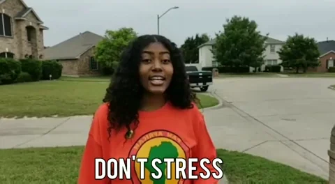 A girl waving and saying don't stress.
