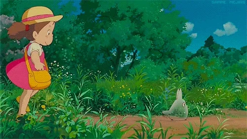 Mei walking outside behind a small forest creature.