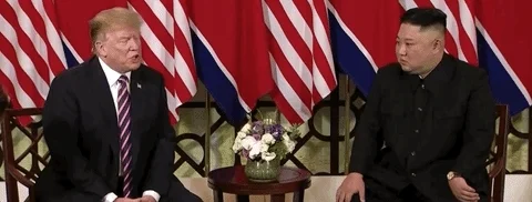 Donald Trump and Kim Jong Un at a meeting.