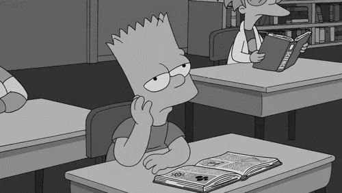 Bart Simpson sitting at school desk looking very bored.