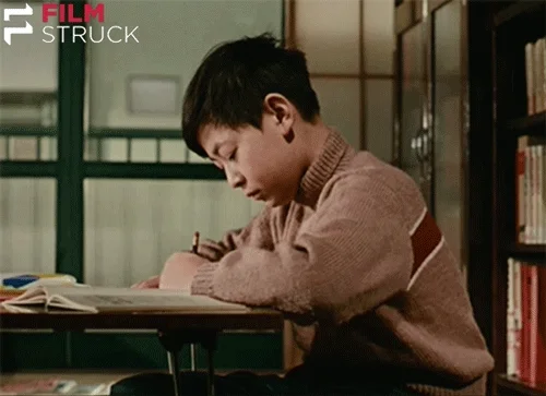 A boy studying at a table.
