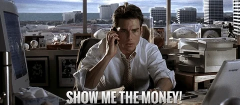 A man (Tom Cruise) talking on the phone and saying, 'Show me the money!'