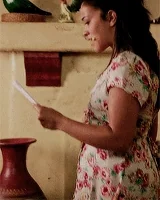 Jane in Jane the Virgin looking confused while studying from a paper.
