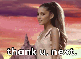 Arianna Grande winking with her left arm raised, pointing with her thumb and pointer finger saying 'thank u, next.'