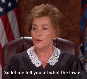 Judge Judy explaining the law in a court room.