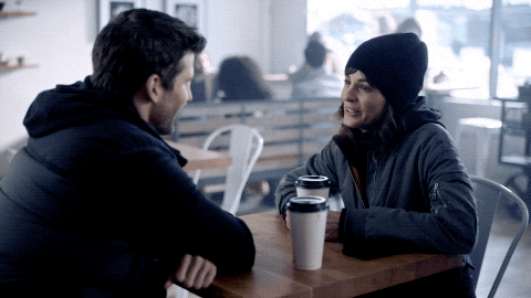 Happy Coffee Date GIF by ABC Network. A couple sitting in a cafe on a coffee date.