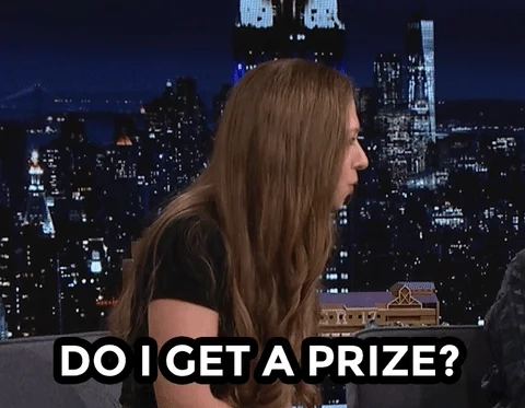 A celebrity asks, "Do I get a prize?" to a talk show host.