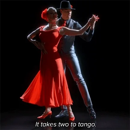 A couple dancing Tango, with the caption: 'It takes two to tango.'