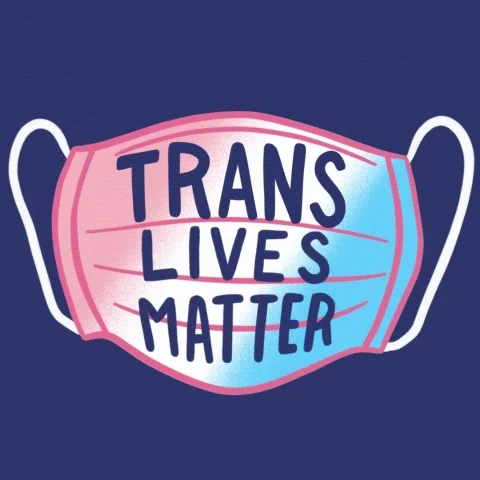 A mask that says 'Trans Lives Matter'.