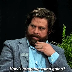 Zach Galifianakis asking someone in an interview, 'How's bragging camp going?'