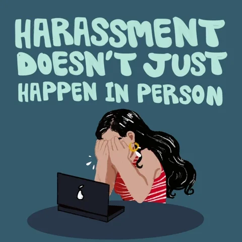 A girl crying infront of her laptop looking at hateful comments online. Text : 'Harrassment doesn't just happen in person'