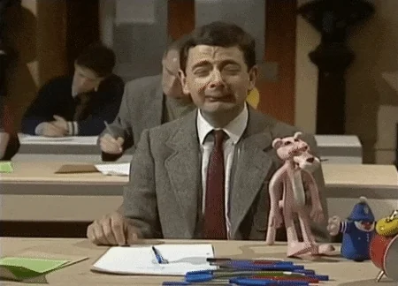 Mr. Bean crying while taking a test.