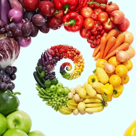 A swirl of fruits and vegetables in a rainbow assortment.