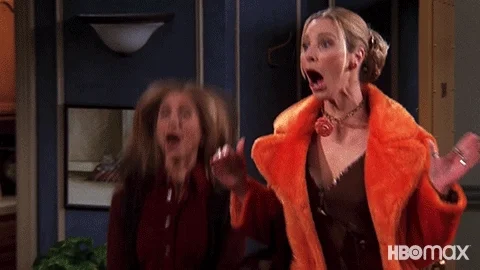 Phoebe and Rachel from Friends clapping and jumping happily.