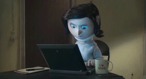 A GIF from the movie Coraline with Coraline's mom typing on a laptop.