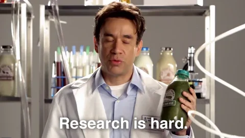 A scientist holds up a bottle of green liquid and says,