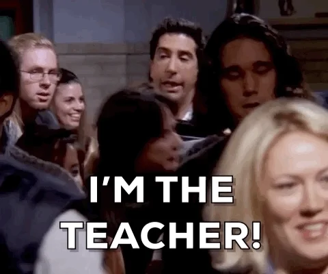 A person walking through the crowd saying 'I'm the teacher!'