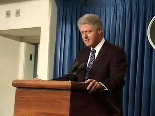 President Bill Clinton abruptly walking off stage at a press conference.