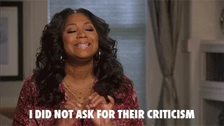 Smiling person says, "I did not ask for their criticism"