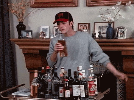 Dylan from Beverly Hills 90210 smelling open alcohol bottles.