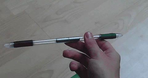 A hand spinning a pen.