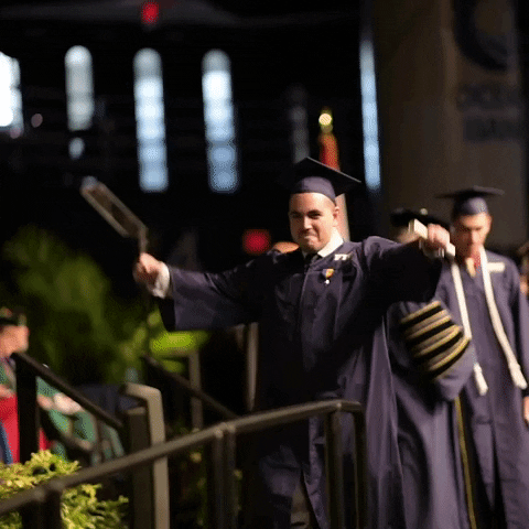 A happy graduate receiving a diploma
