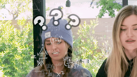 A woman looking confused as math equations appear in the air around her
