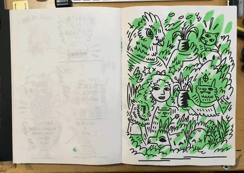 A person flips through a student's art notebook.