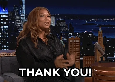GIF of woman (Queen Latifah)  smiling and  pointing at the camera. Text reads Thank You!