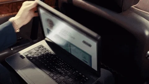 A woman opens her laptop, and an interviewee appears on the screen. She says, “I'll hire remote talent.”