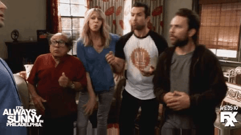 The cast of It's Always Sunny in Philadelphia huddling to ask, 
