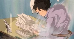 An anime character studying while papers fly around their desk.