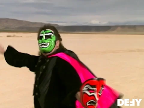 Criss Angel in a desert wearing two different kinds of masks.