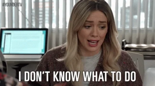 A stressed woman in an office says, 