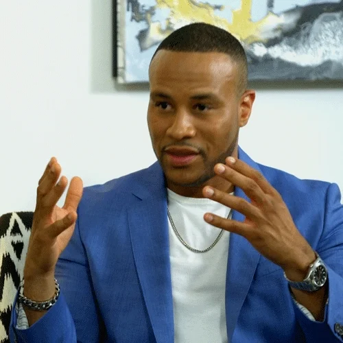 Person speaks earnestly while moving their hands together and partly joining them