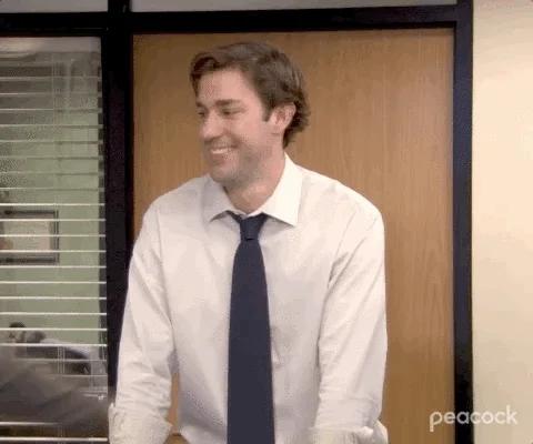 GIF: Michael tackle-hugs Jim. (by The Office)