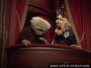 Stadler & Waldorf talking to each other on a balcony.