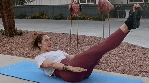 Girl performing the hundreds exercise from Pilates.