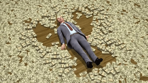 man making snow angel in pile of money