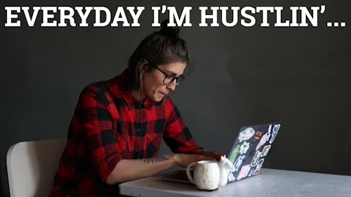 A woman rapidly types at her laptop while drinking coffee. The text reads, reads 'Everyday I'm hustlin'...'
