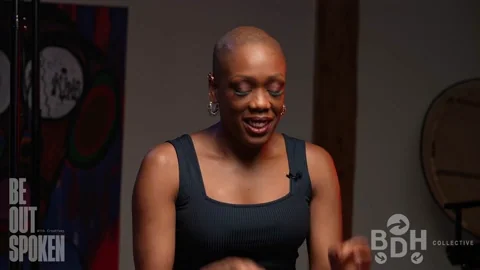 A woman using motivational interviewing gestures as she pieces together information.