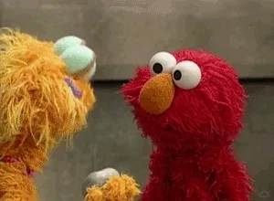 Elmo looking confused during a conversation.