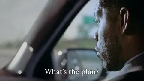 A man in a car saying: “What’s the plan?”