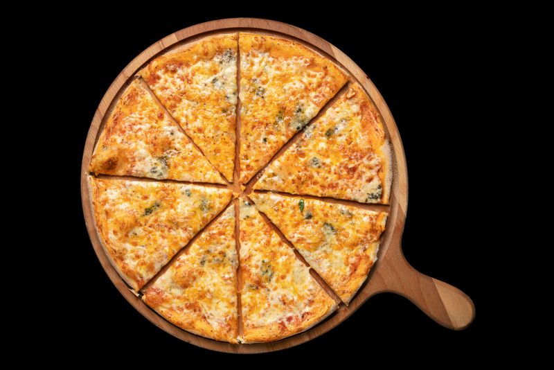 A cheese pizza in 8 slices on a cutting board.